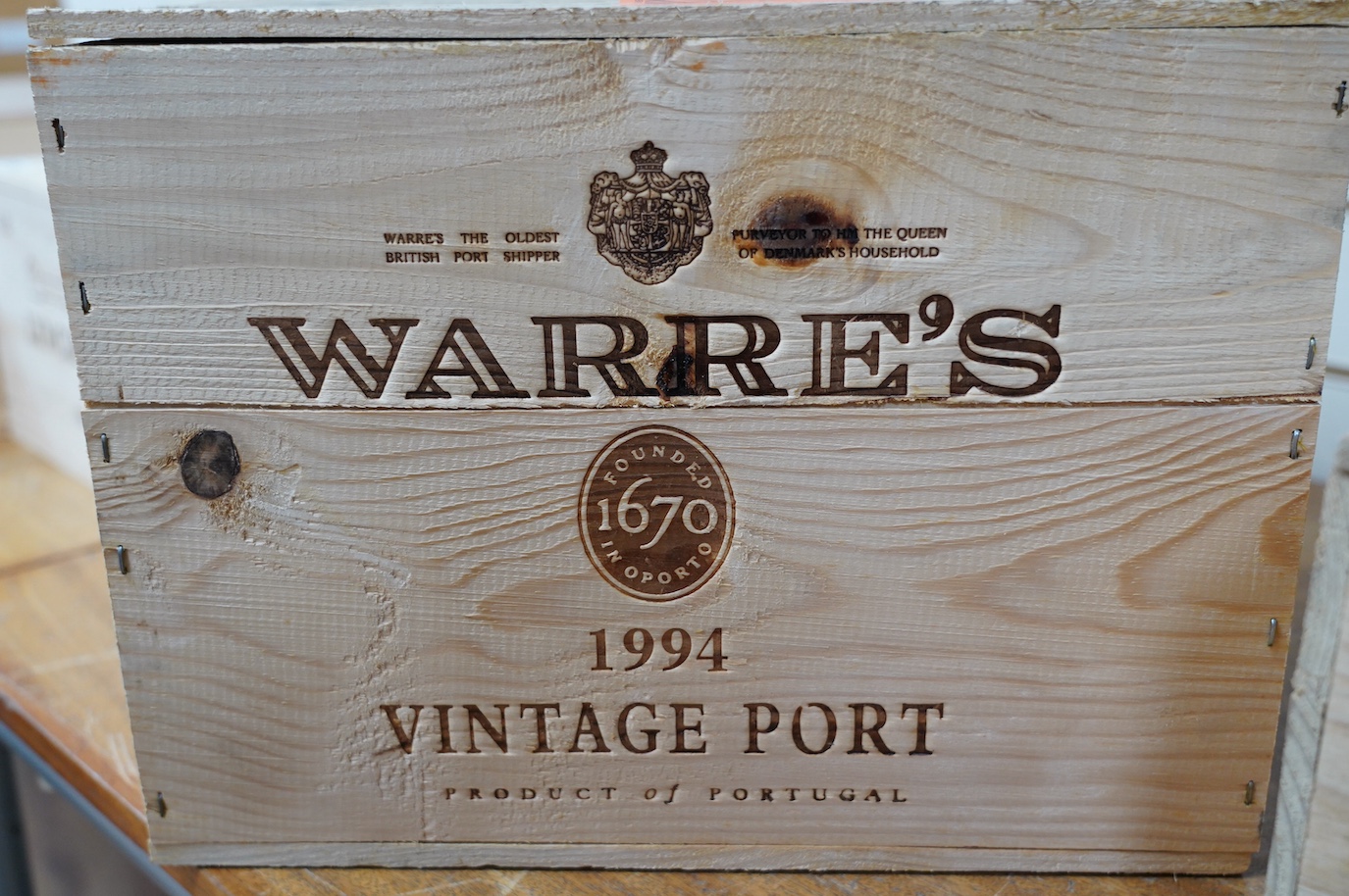 A sealed case of twelve bottles of 1994 Warres Vintage Port, in OWC, purchased en primeur from The Wine Society. Condition - good